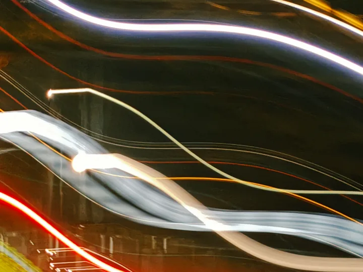 Light trails streaking through a night street
